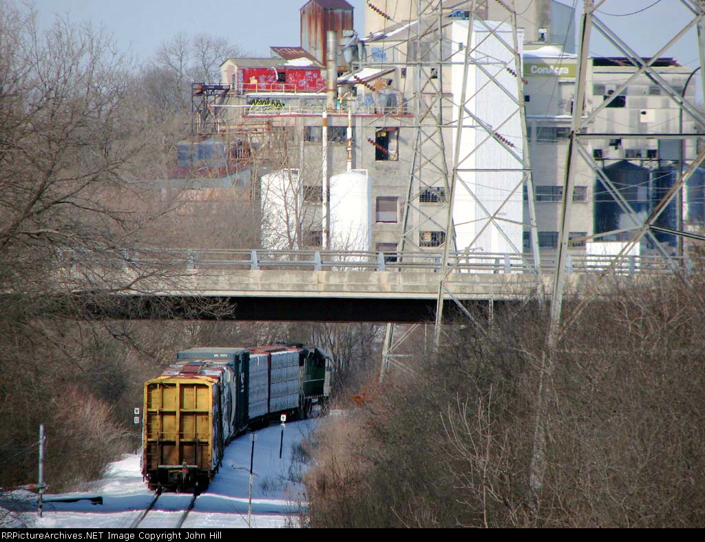 100222011 BNSF "Monti Local" passing nearby Fruen Milling on Monticello Sub.
