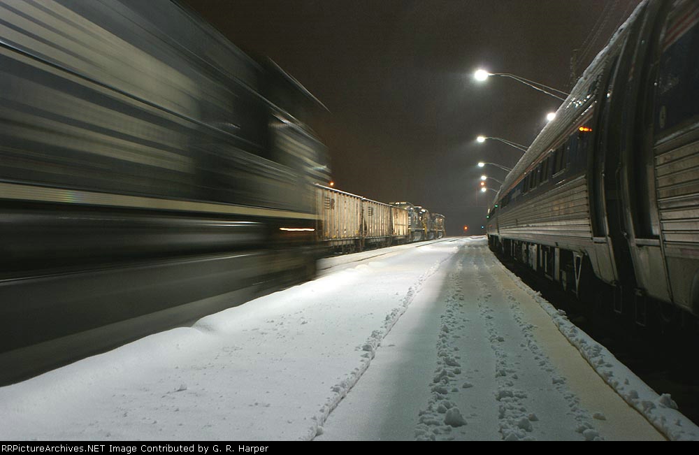 NS train 214 roars past NS 88M to the left and LYH NEC Regional train on the right.