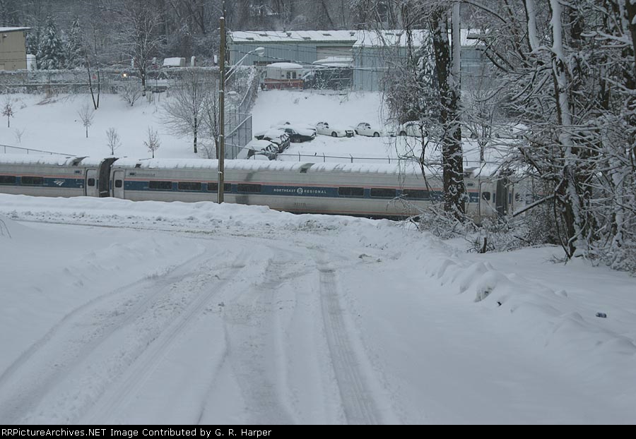 NEC Regional cafe car beyond the end of a snowy 7th Street