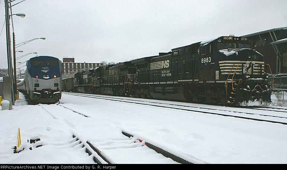 NS 88M and the Lynchburg NEC train side-by-side at the north end of the platform