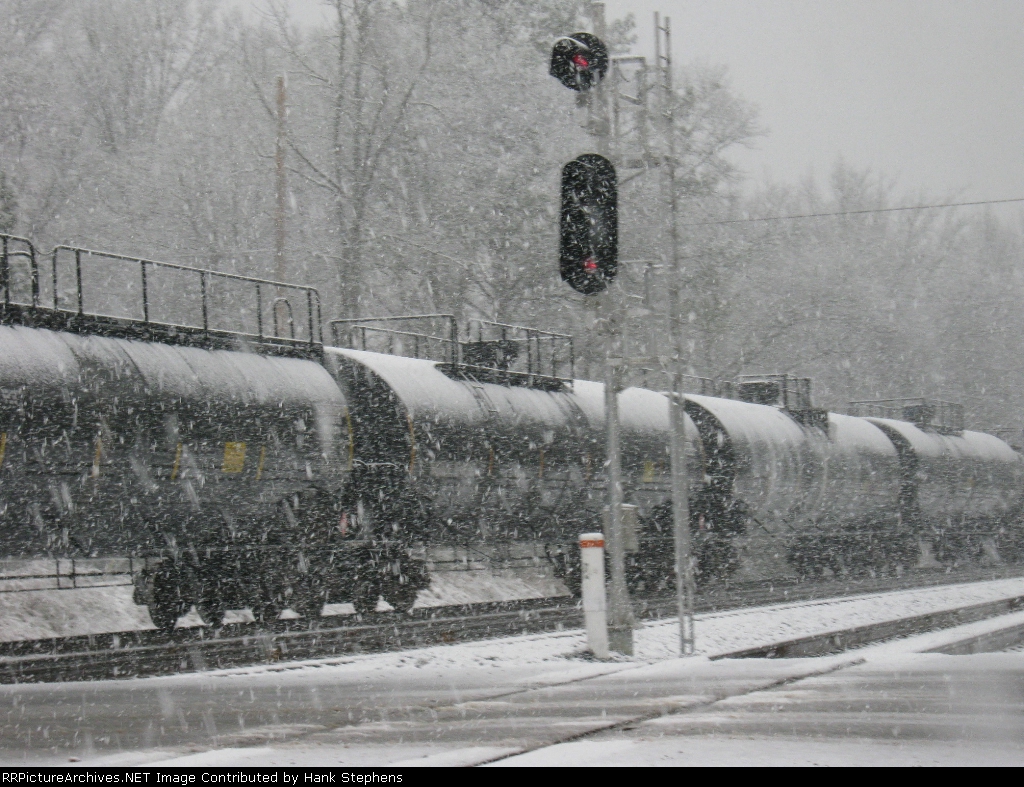 Tank cars on Q608 as it heads north to Atlanta in the snow after meeting Q615 at Gabbetville Siding