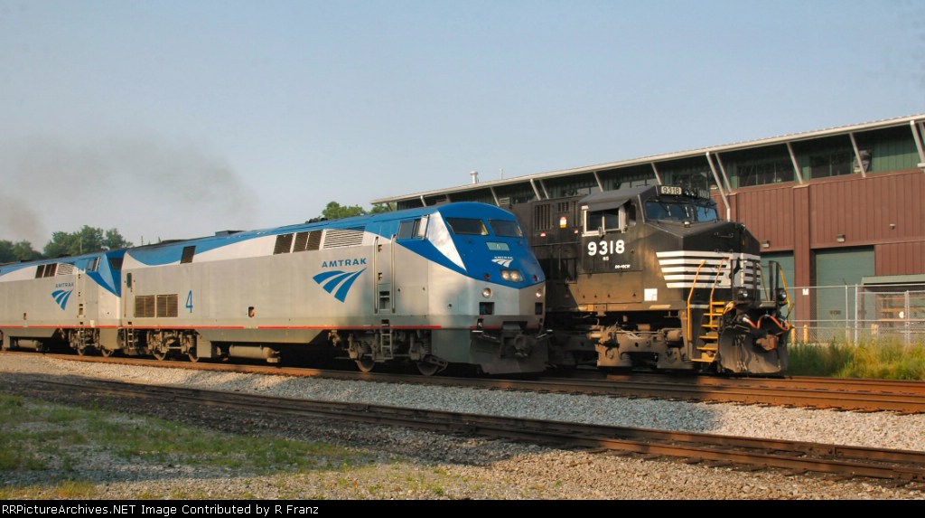 Amtrak Crescent departs Kemper Street Station passing NS Coal train