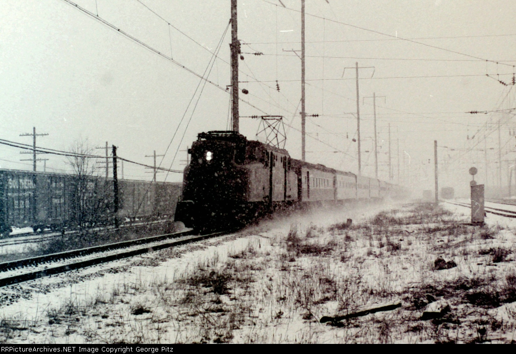 GG1 and train kick up some snow