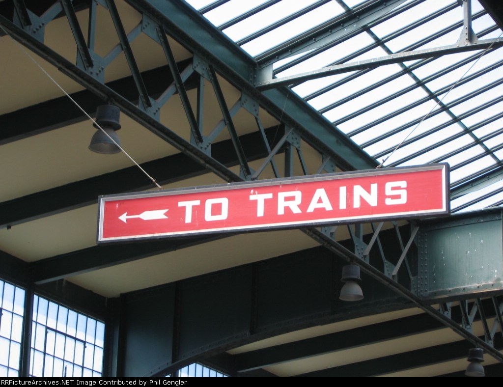 "To Trains" sign