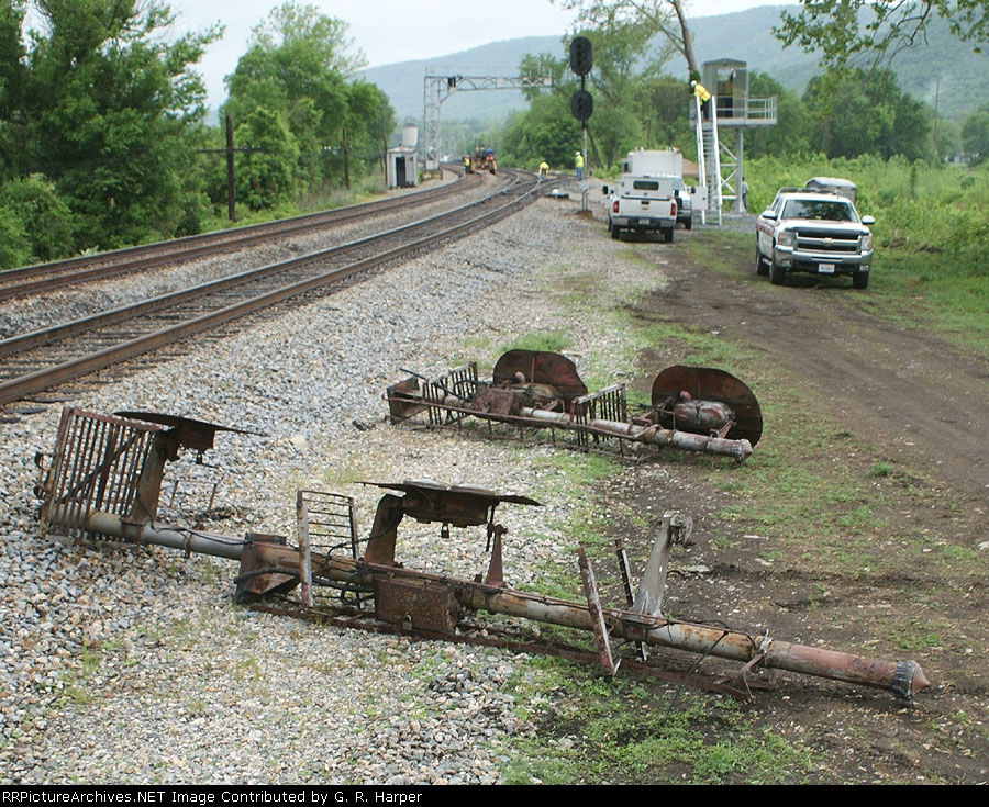 Signal heads on the ground awaiting removal