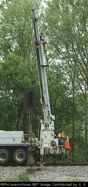 Westbound signal at Gilmore Mills is lifted off pedestal.