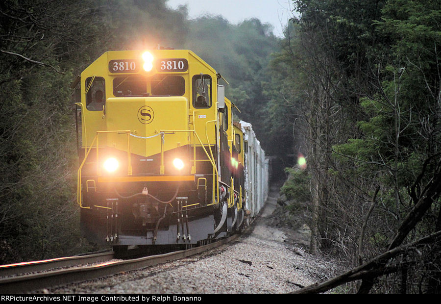 Westbound SU 99, under overcast skies, rolls westbound through the sag at MP 48