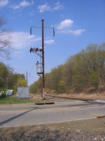 Out of Service Catenary Tower, Amboy Secondary. This tower has a paltform with a rod that was used to turnm the power on or off. This secondary was electrified at one time  