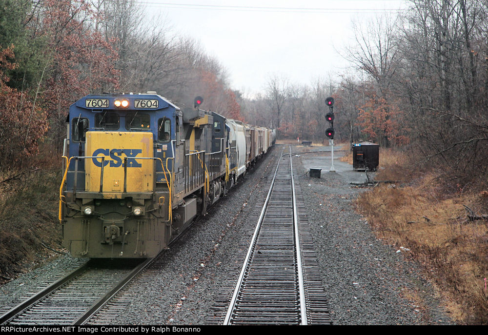 Q417 departs the yard for NJ and enters the River Line at CP SK on an overcast morning