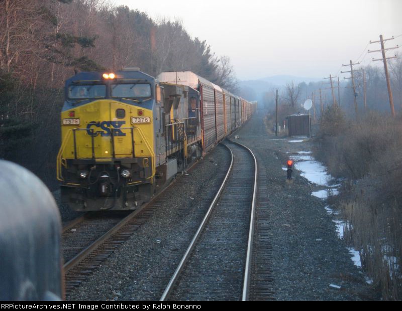 Our very late running  northbound  sit in the hole as the Q254 passes at CP 121