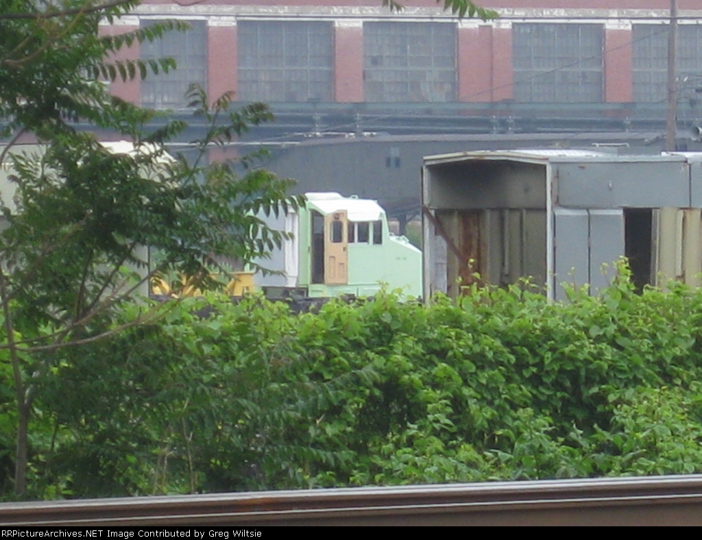 A cab to a new GE loco waits inside the GE shops
