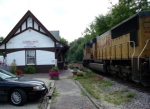 UP 4642 passing the old C&NW depot, now a flower shop