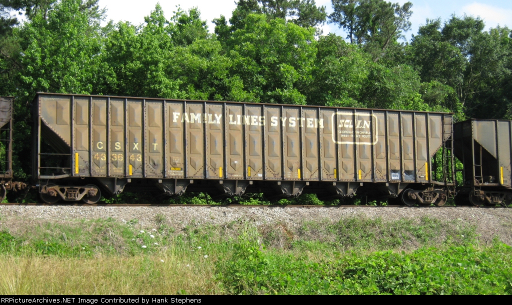 CSX 433643 sits in the storage siding at Cusseta, AL.  Local A746 brings the chips up from Montgomery for the Frasier Lumber mill just to the south.  Extra cars are left in the siding until needed.