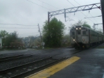 Train arriving in the rain