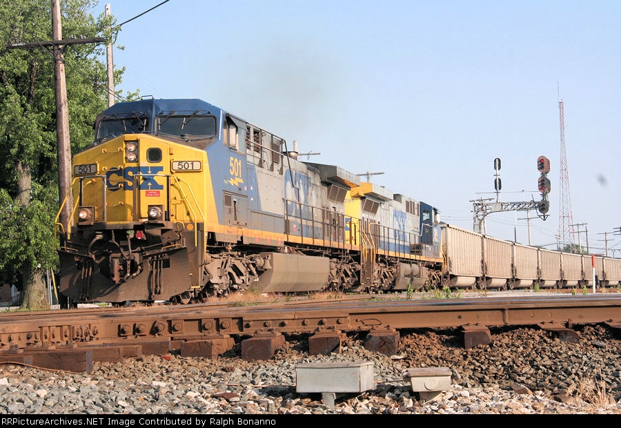 North(east)bound hopper train U933 rumbles thru town, about to cross the NS diamonds