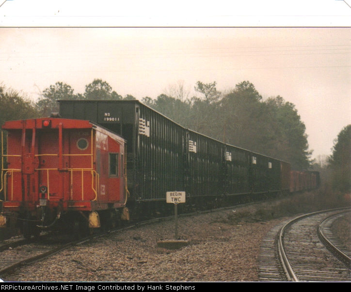 PICTURE SIX--The caboose marks the end of the train as the Turn is now back on home rails at Roanoke Jct