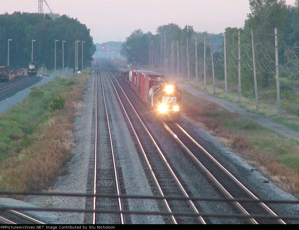 Northbound NS freight breaks the fog at Lockbourne OH