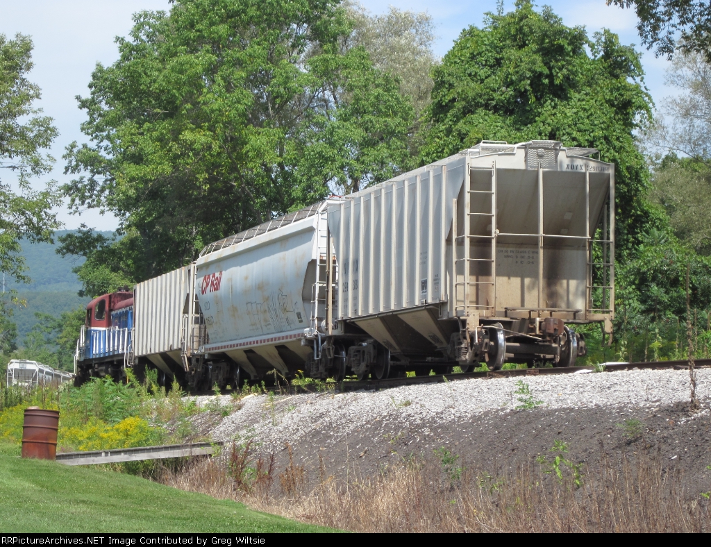 A short train waits to get into the unloading yard