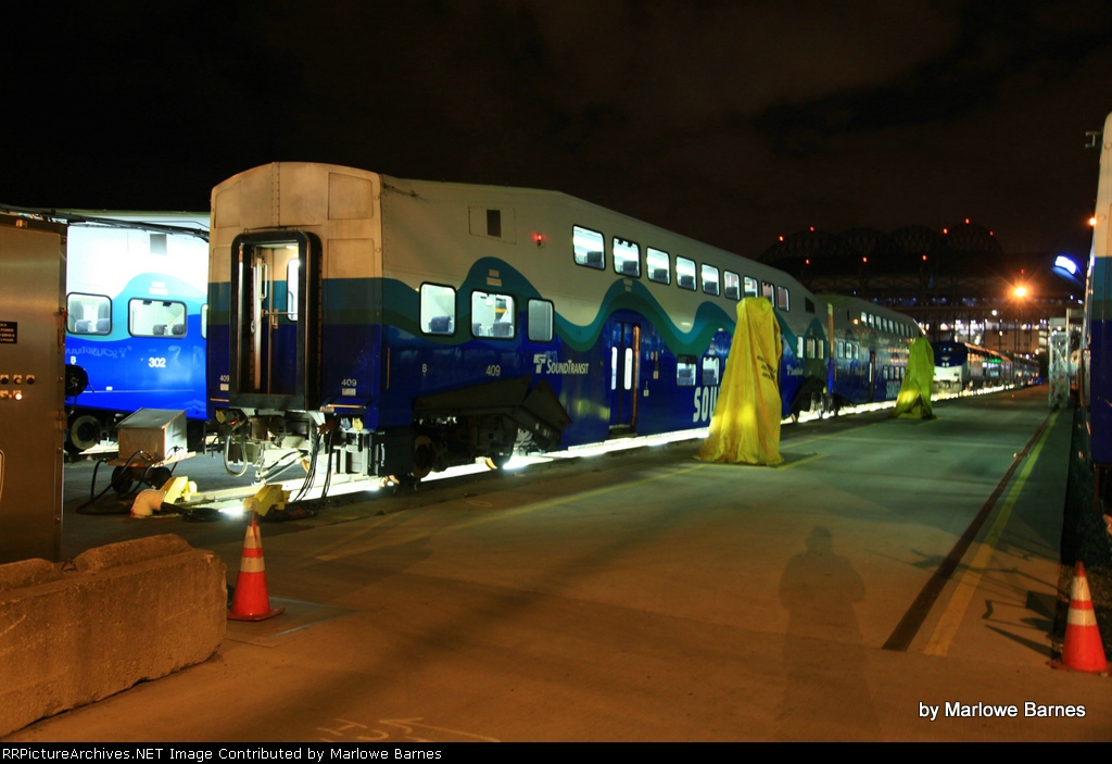 Sound Transit no. 409 and brethern undergo maintenance with Safeco Field in the background
