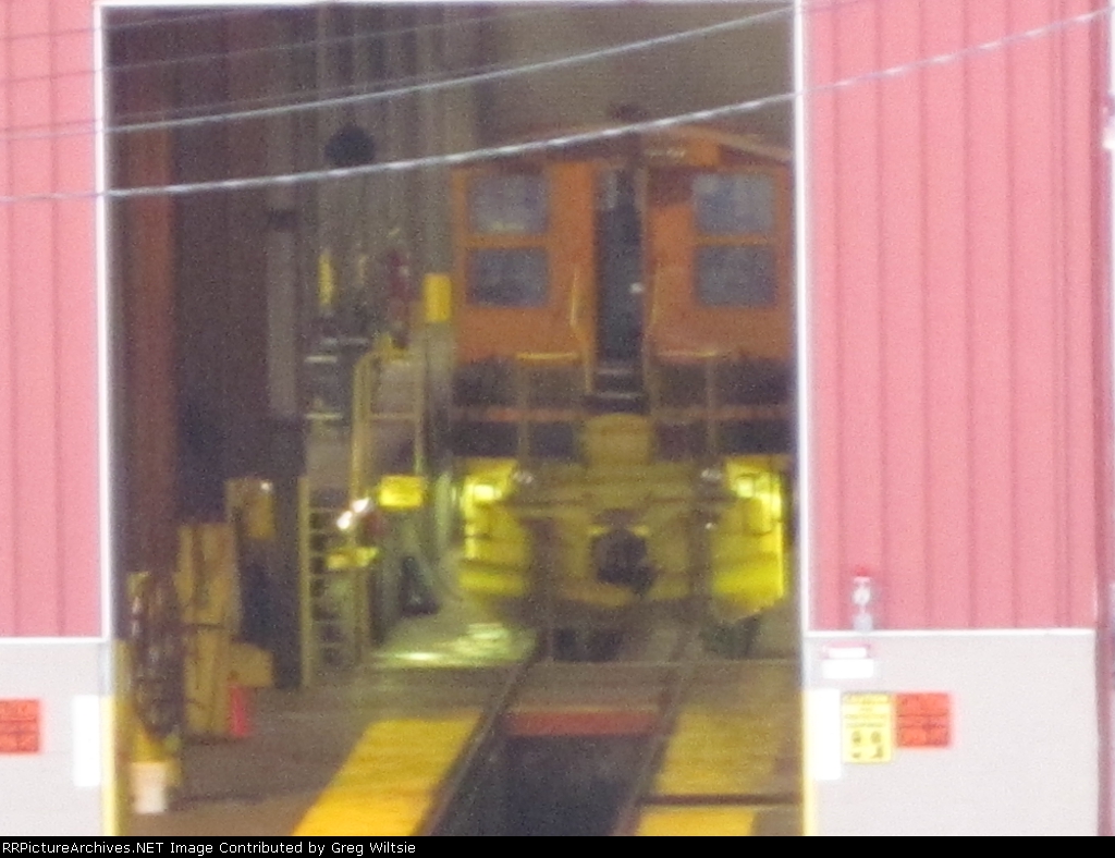 A switcher is seen inside the shop building