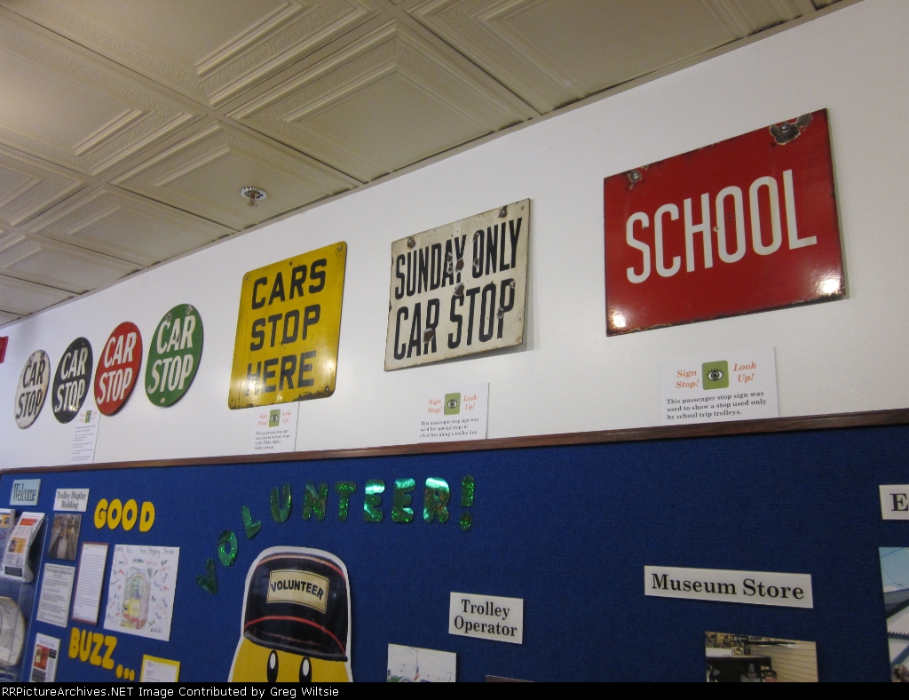 Various trolley related signs inside the museum building
