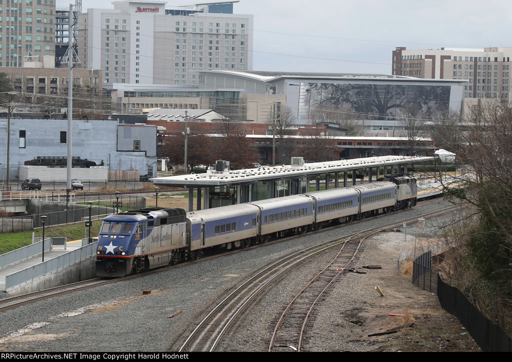 RNCX 1755 leads train 75 away from the platform
