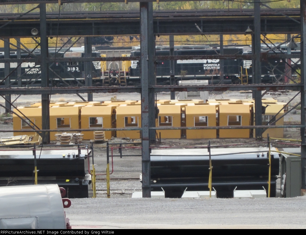Rows of new cabs wait in the shops complex