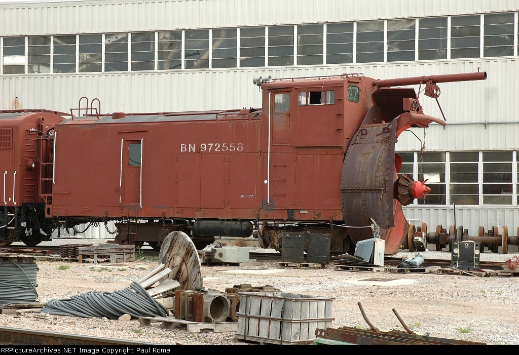 BN 972558, Rotary Snow Plow, bent blower shaft and and damaged rotary shroud awaiting repair
