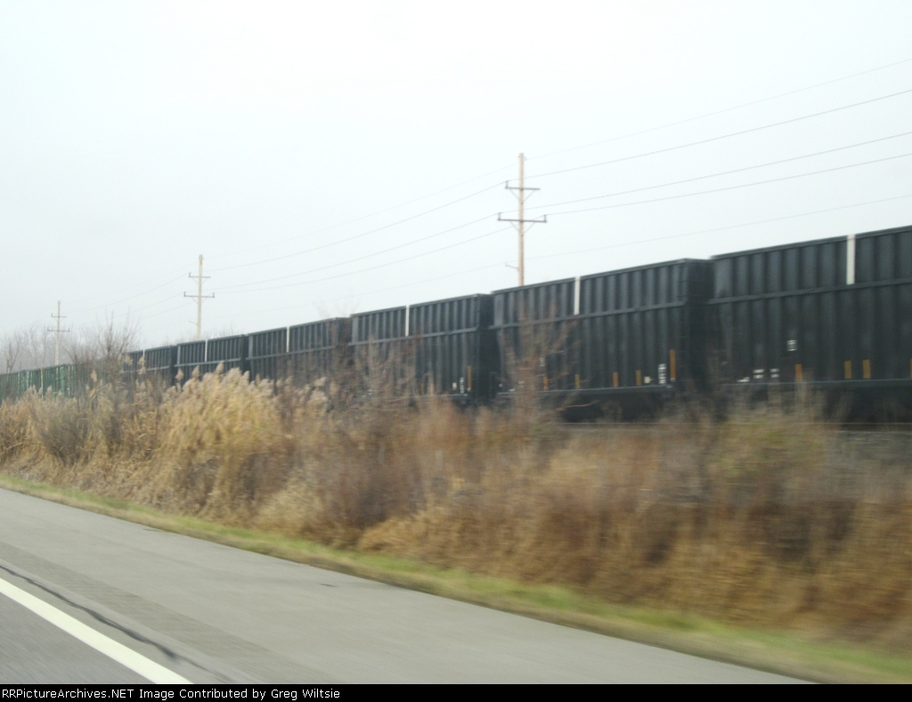Row of unlettered woodchip hoppers