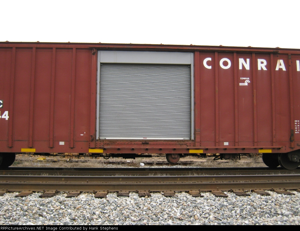 Detail shot of roll up door modification to parts boxcar on CSX C-2 Rail Gang support train.