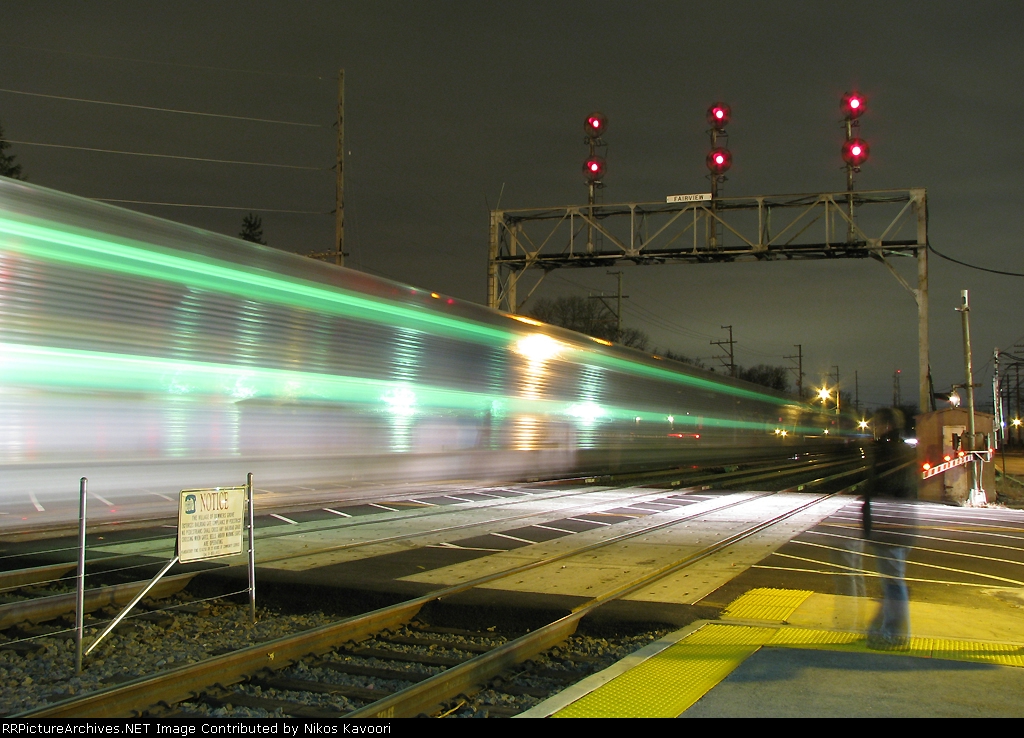 Metra streaking under the old CBQ signals at Fairview Avenue