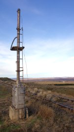 Old signal mast watches over the valley.