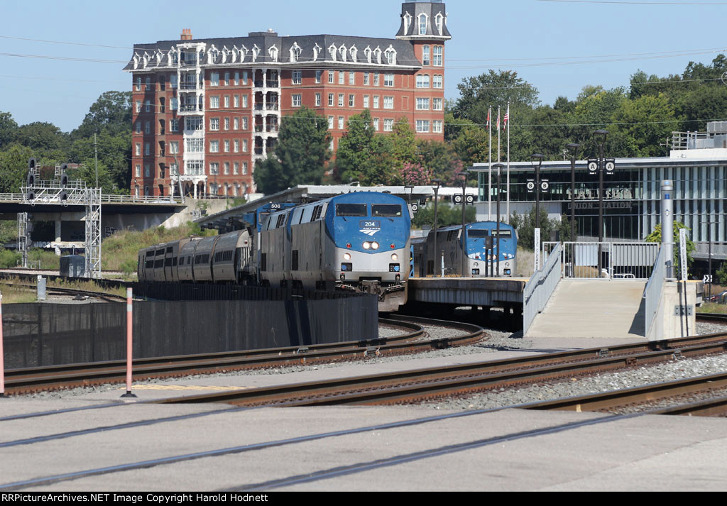 AMTK 204 leads train P092-06 away from the station