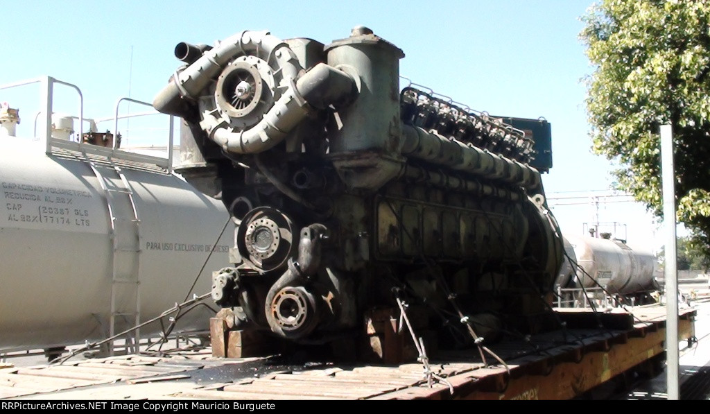 Prime mover over a flat car