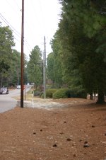Looking North. The roadbed continued as it paralled highway 2 on the left and #2 golf course on the right. You can barely make out the roadbed location, but the power poles are about where the track used to run.