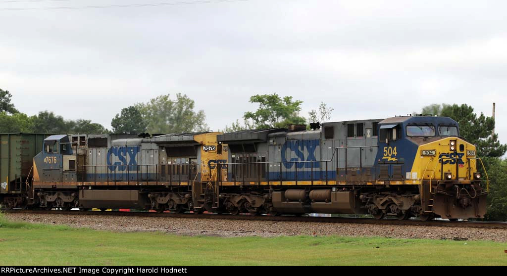 CSX 504 & 7676 lead train Q477-04 towards the yard