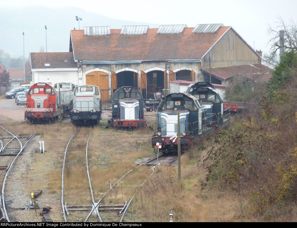 Various locos in Autun's locomotive shops: mainly 66000 class (blue and red samples) and a pair of 63000 class (two grey samples).