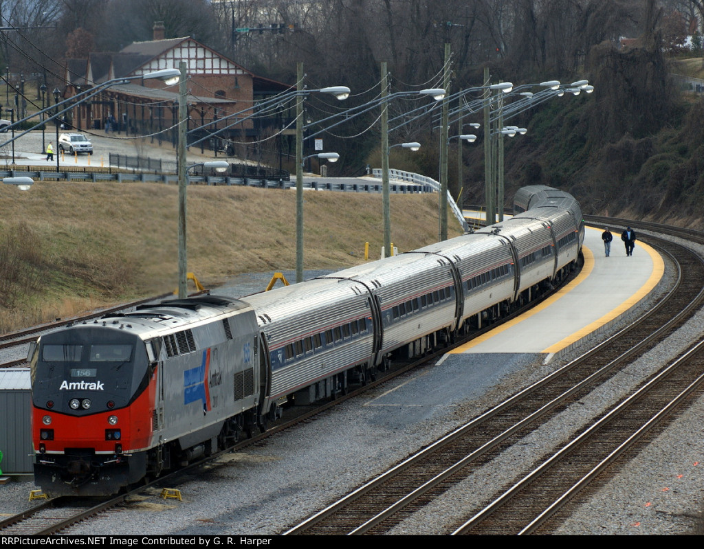 Train 156's crew reporting for duty strolls down the platform