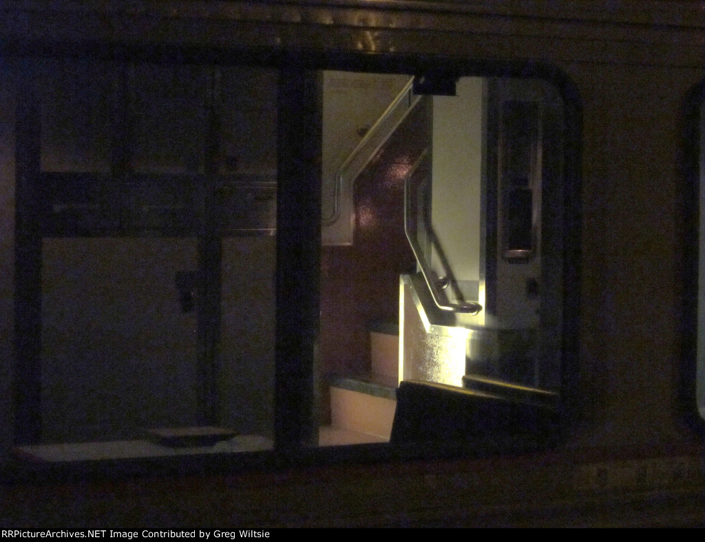 The staircase that goes from the first level to the second level of a Superliner car