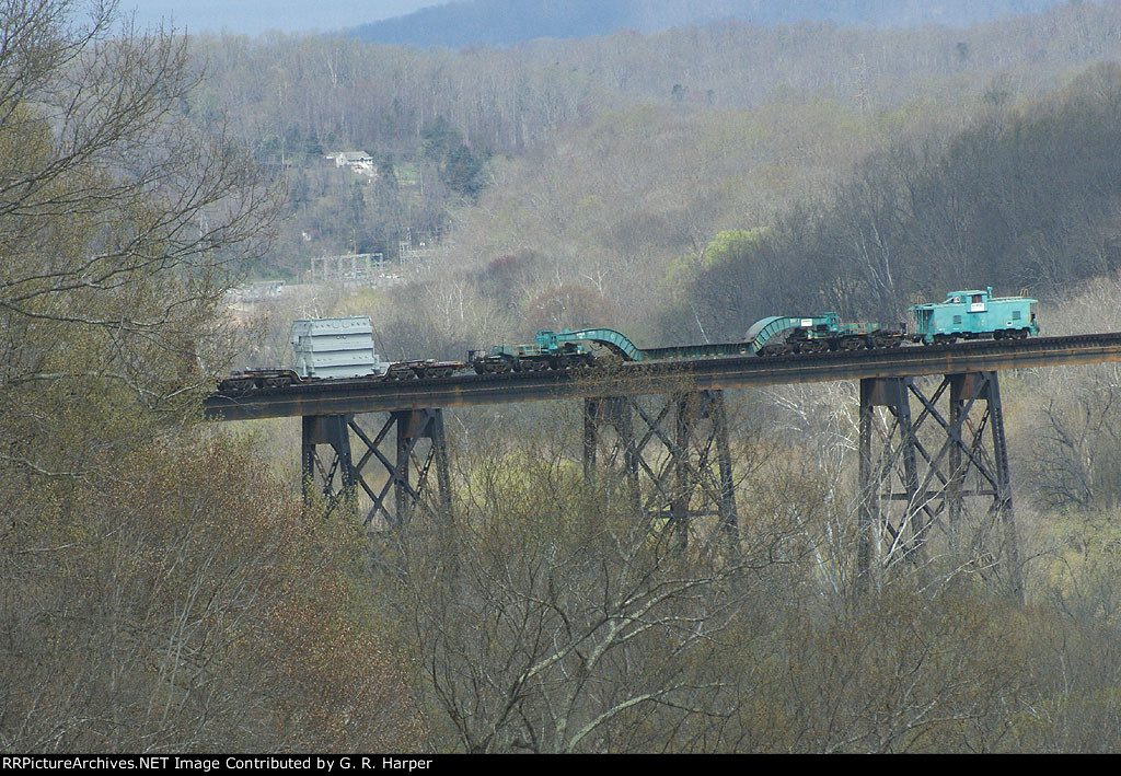 transformer  depressed-center flat and Caboose on rear of NS train 054 crossing the James River