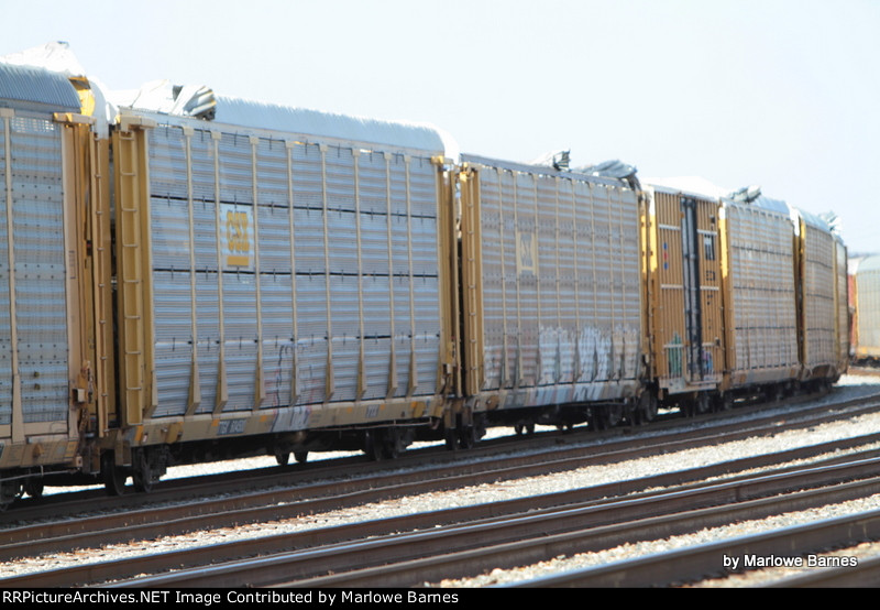 Part of 8 cars that were peeled back by a low bridge in Baltimore's Locust Point Terminal