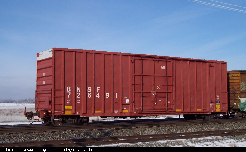 BNSF 726491 brings up rear of UP local 43 freight