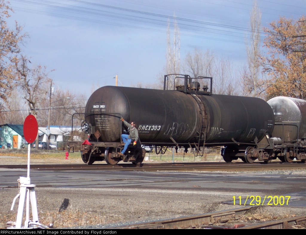 DACX 303 backs across North 7th Ave. crossing 