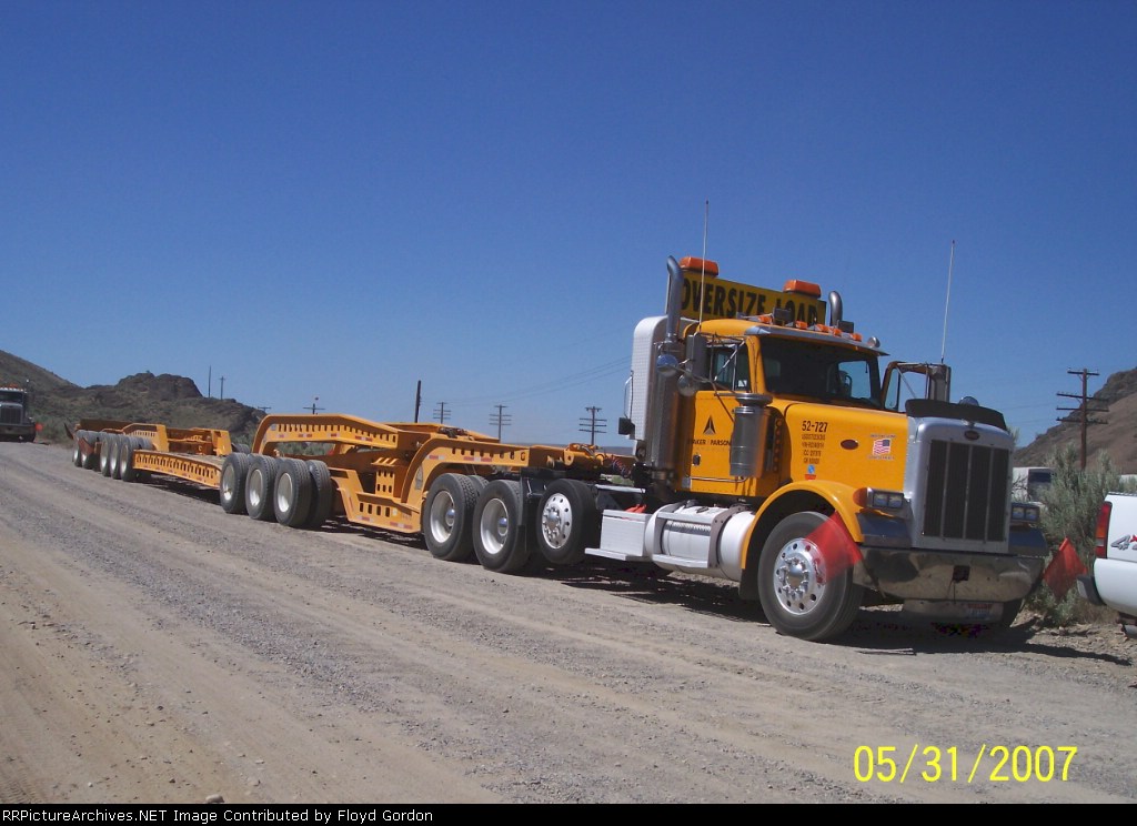 Truck and trailer used to bring in heavy equipment at derailment