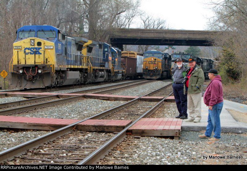 Members of the St. Denis Papparrazi patiently wait for something to move