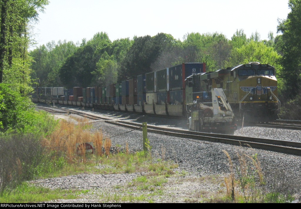 CSX OTR carmen dusts up the access road as he heads to the end of the train to clear it to move north.