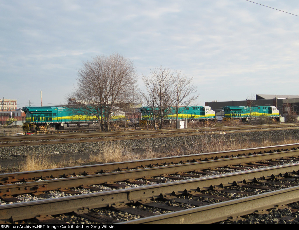 3 Vale (Brazil) ES58ACi's sit on flatcars at the GE plant