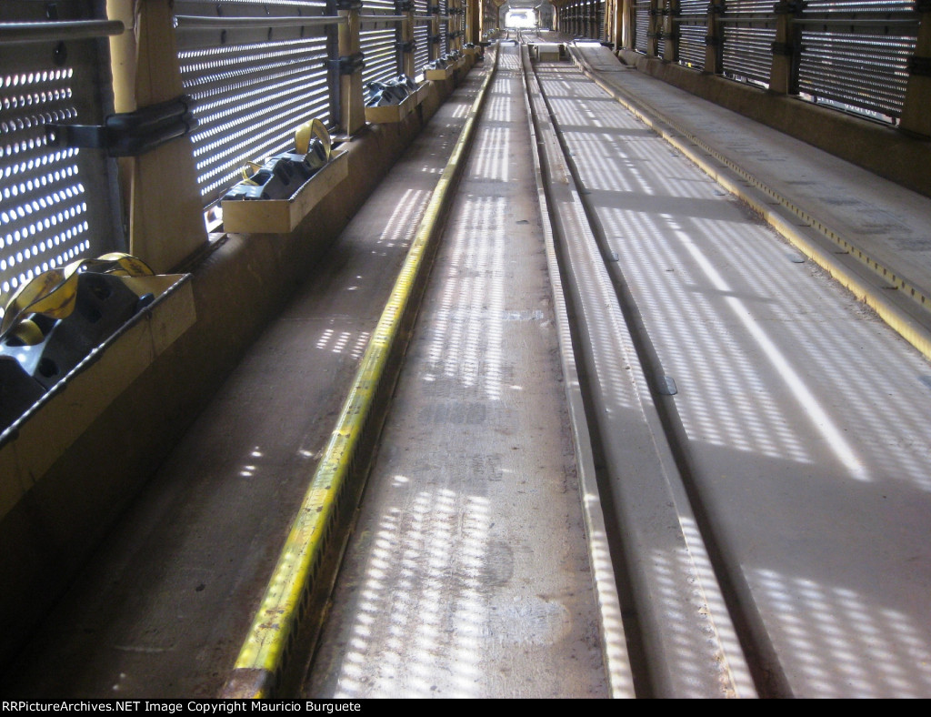 Inside of a tri-level autorack - rail to secure the vehicles