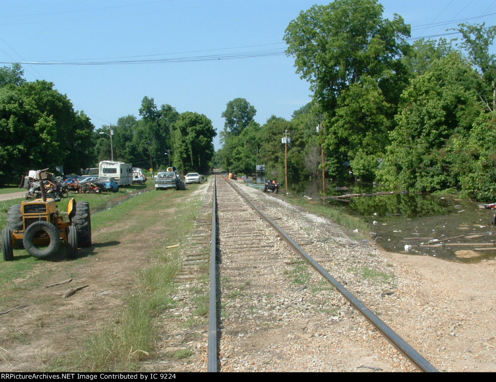 People in flooded homes have moved their possessions to the road