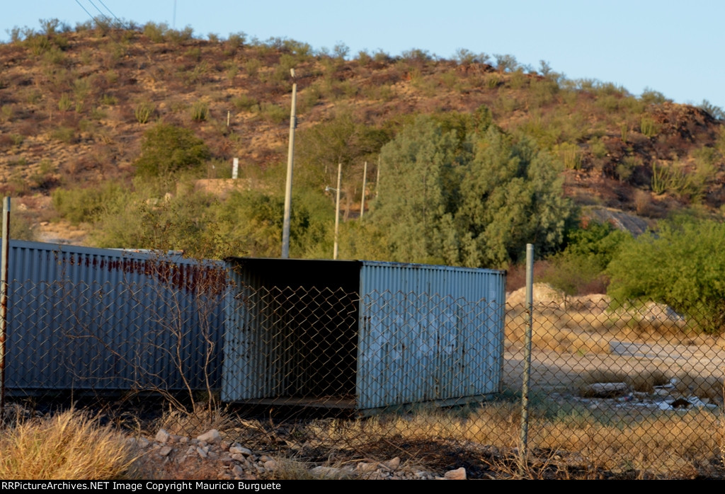 Containers laying next to the street
